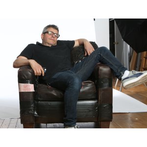 Photographer Eric  Hason in distressed club chair