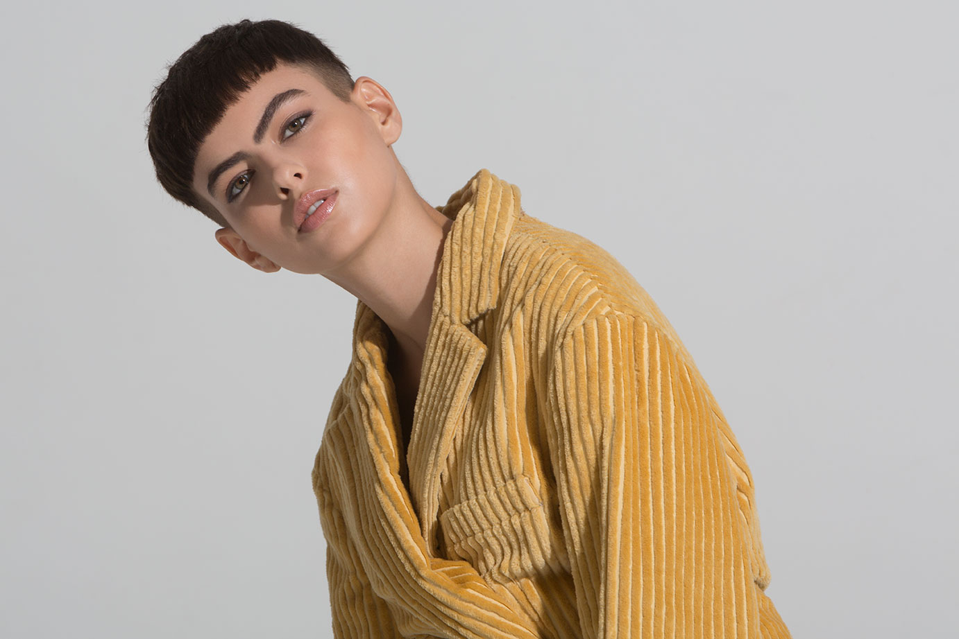 New York fashion photographer Eric Hason photographs model Hayden Graye from State Management wearing a gold corduroy jacket by Land of Distraction for Basic Magazine.